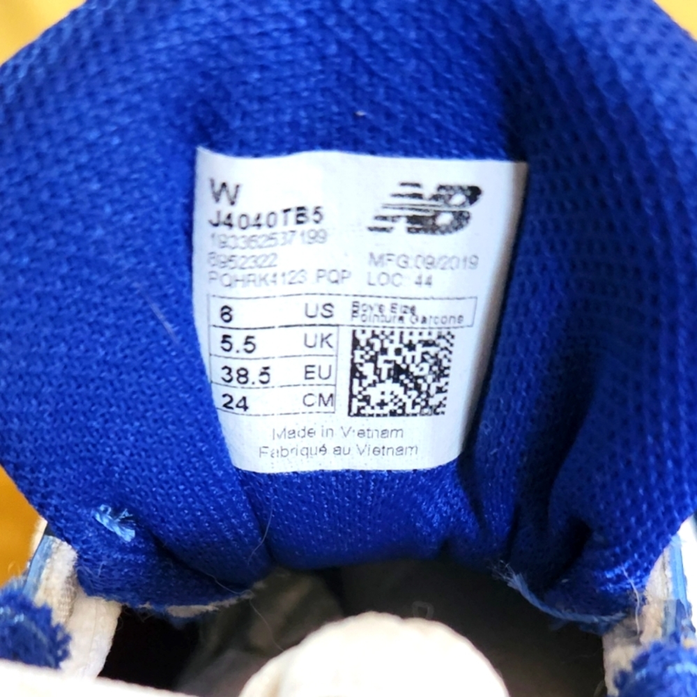 Blue and white New Balance baseball cleats boys size 6